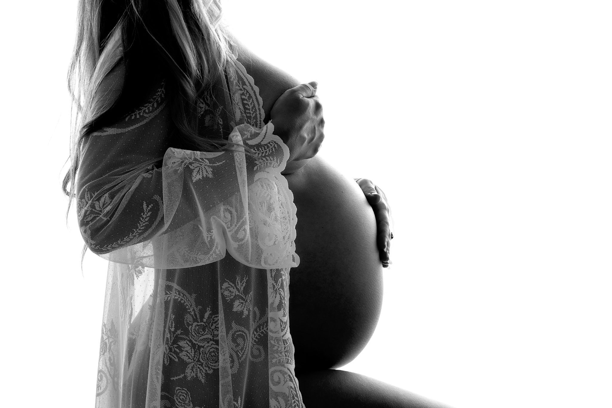 silloet billede af en gravid i sh