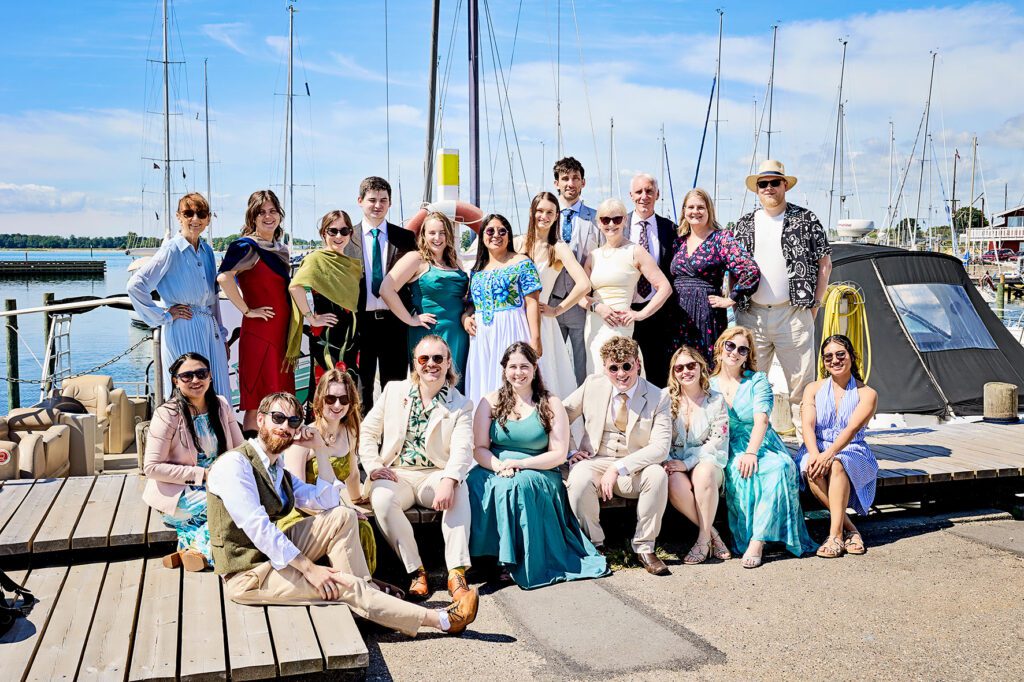 the brides with all the guests at the harbor stevns